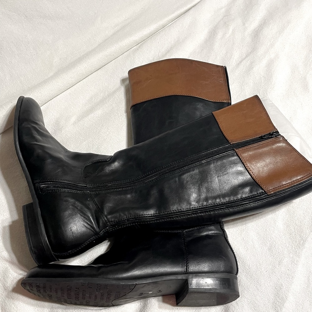 Black and brown knee high leather boots